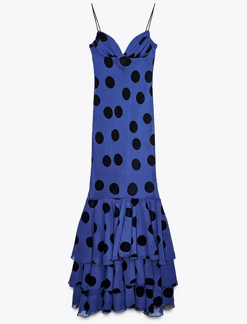 Blue dress with black polka dots on a white background