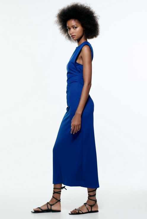 Woman in blue dress and black shoes