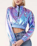 Person wearing a colorful blue iridescent jacket on a light gray background