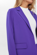 Purple blazer worn by a person on a white background