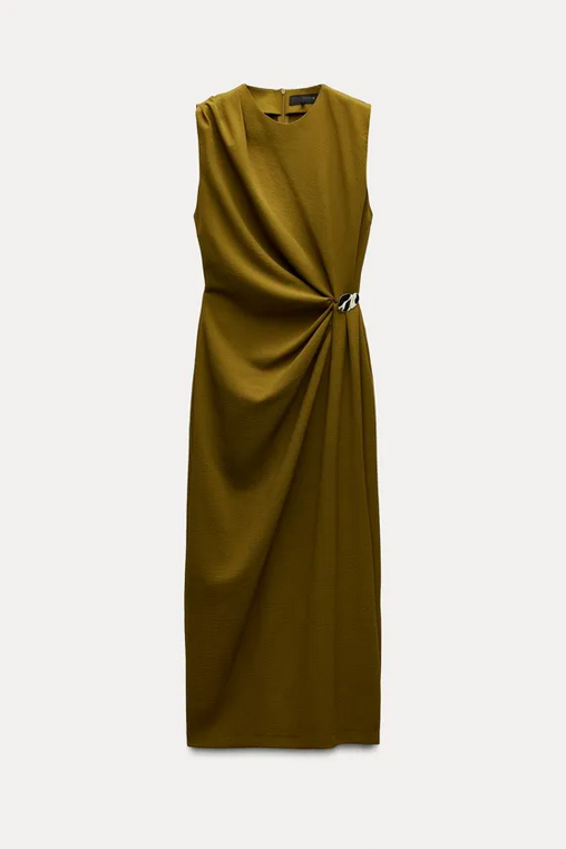 Mustard yellow dress with a knot detail on a white background